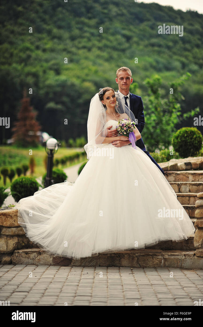 young happy wedding couple at the nice nature Stock Photo - Alamy