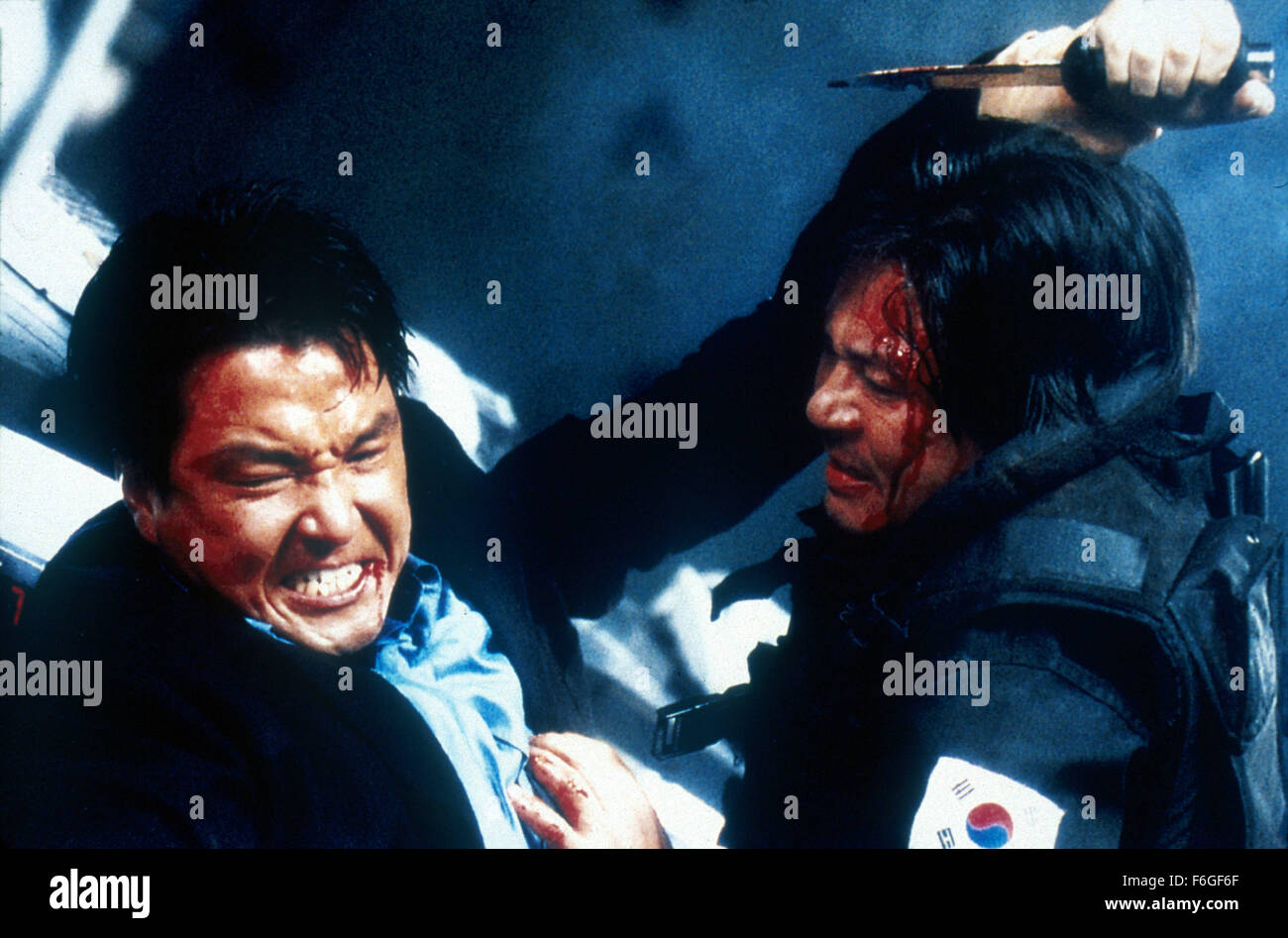 Feb 13, 1999; Seoul, SOUTH KOREA; SUK-KYU HAN (left) as JongWon Yu and MIN-SIK CHOI as Mu-young Park in the romantic, action, thriller ''Swiri'' directed by Je-gyu Kang. Stock Photo