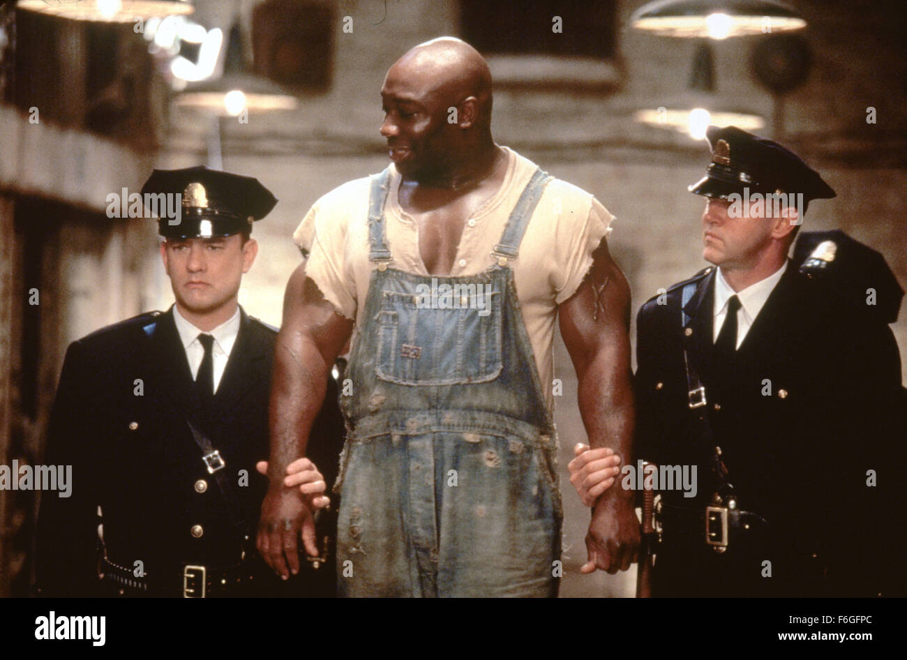 RELEASE DATE: 10 December 1999. MOVIE TITLE: The Green Mile. STUDIO: Castle Rock Entertainment. PLOT: The story about the lives of guards on death row leading up to the execution of black man accused of child murder and rape, who has the power of faith healing. PICTURED: TOM HANKS as Paul Edgecomb with MICHAEL CLARKE DUNCAN as John Coffey and DAVID MORSE as BrutusBrutal Howell. Stock Photo