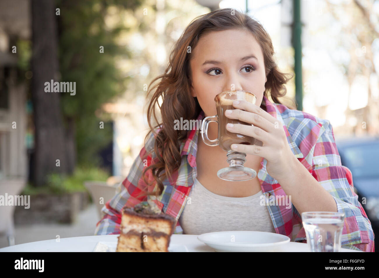 Girl drinking a cup of coffee Stock Photo