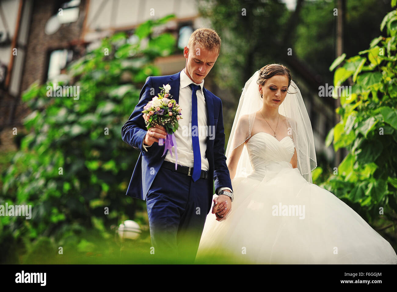 young happy wedding couple at the nice nature Stock Photo - Alamy