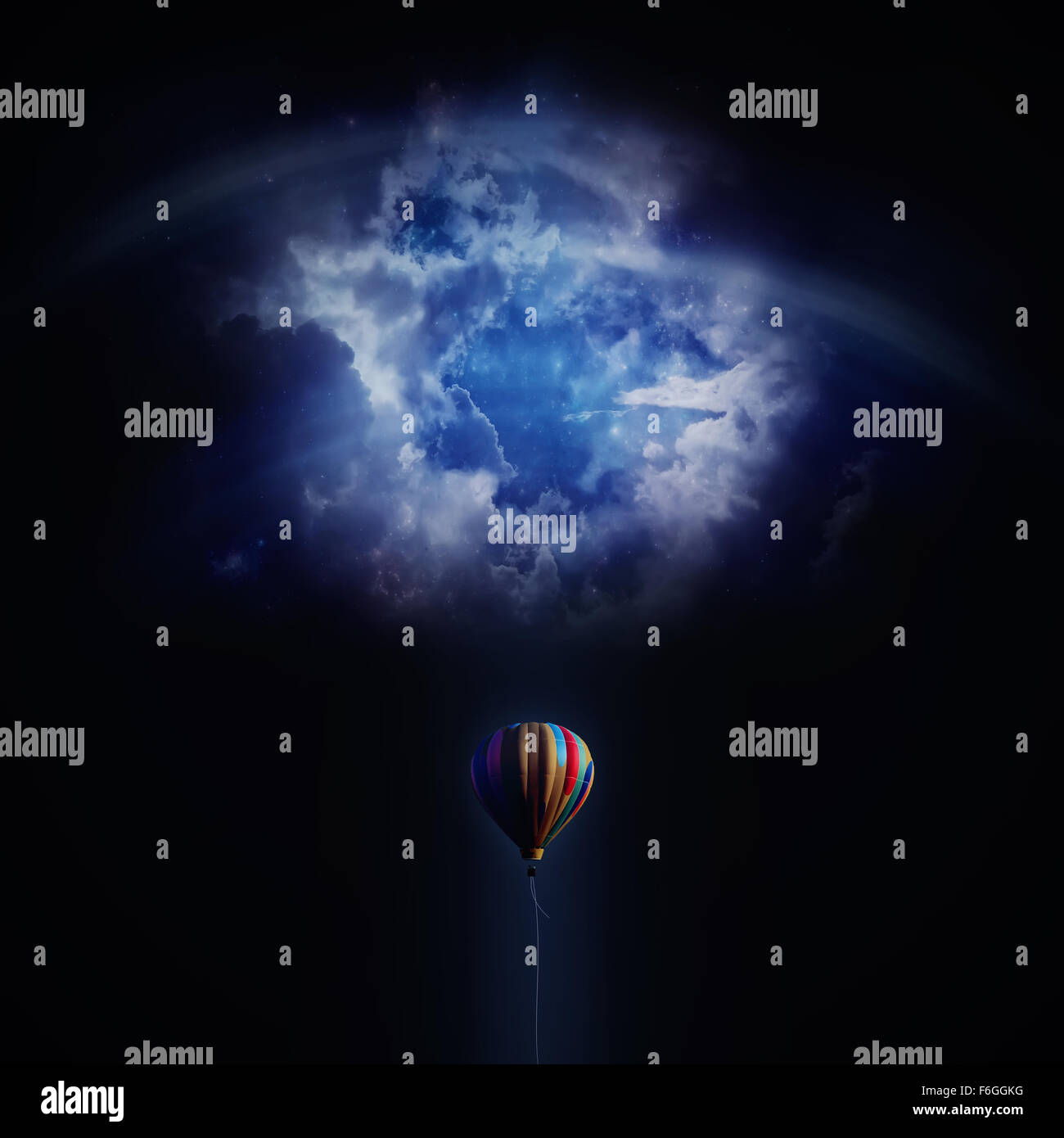 An air balloon fly in blue night sky hole Stock Photo