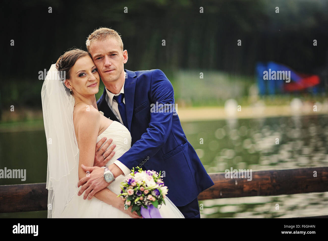 young happy wedding couple at the nice nature Stock Photo - Alamy