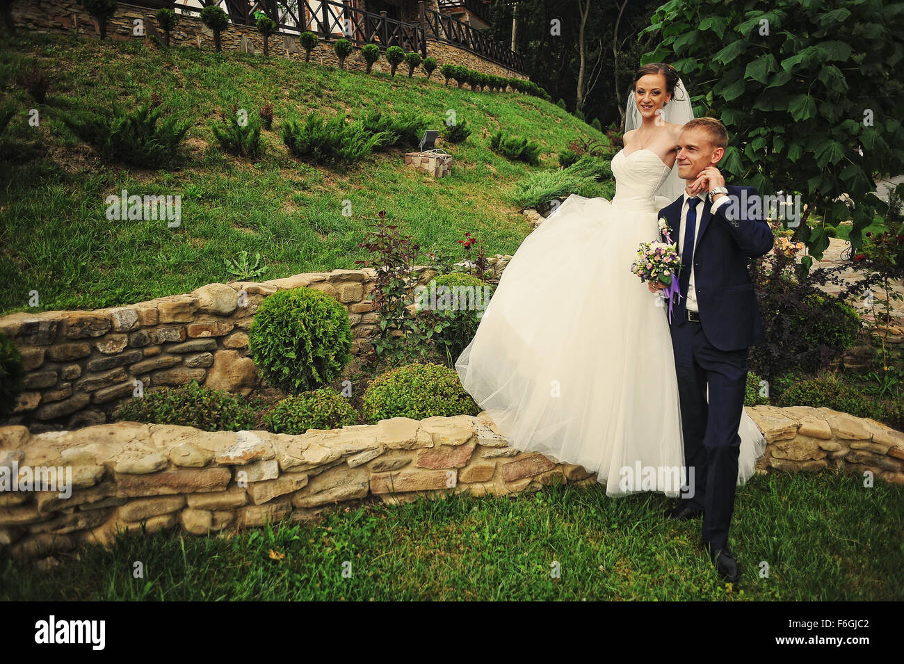 young happy wedding couple at the nice nature Stock Photo - Alamy
