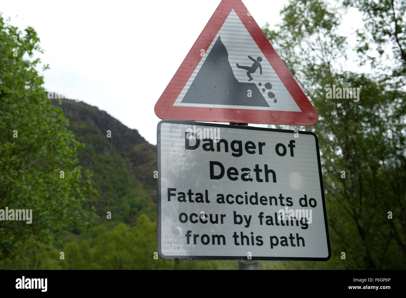 Warning signage at the start of the Glen Nevis walks telling walkers to be careful and watchful Stock Photo