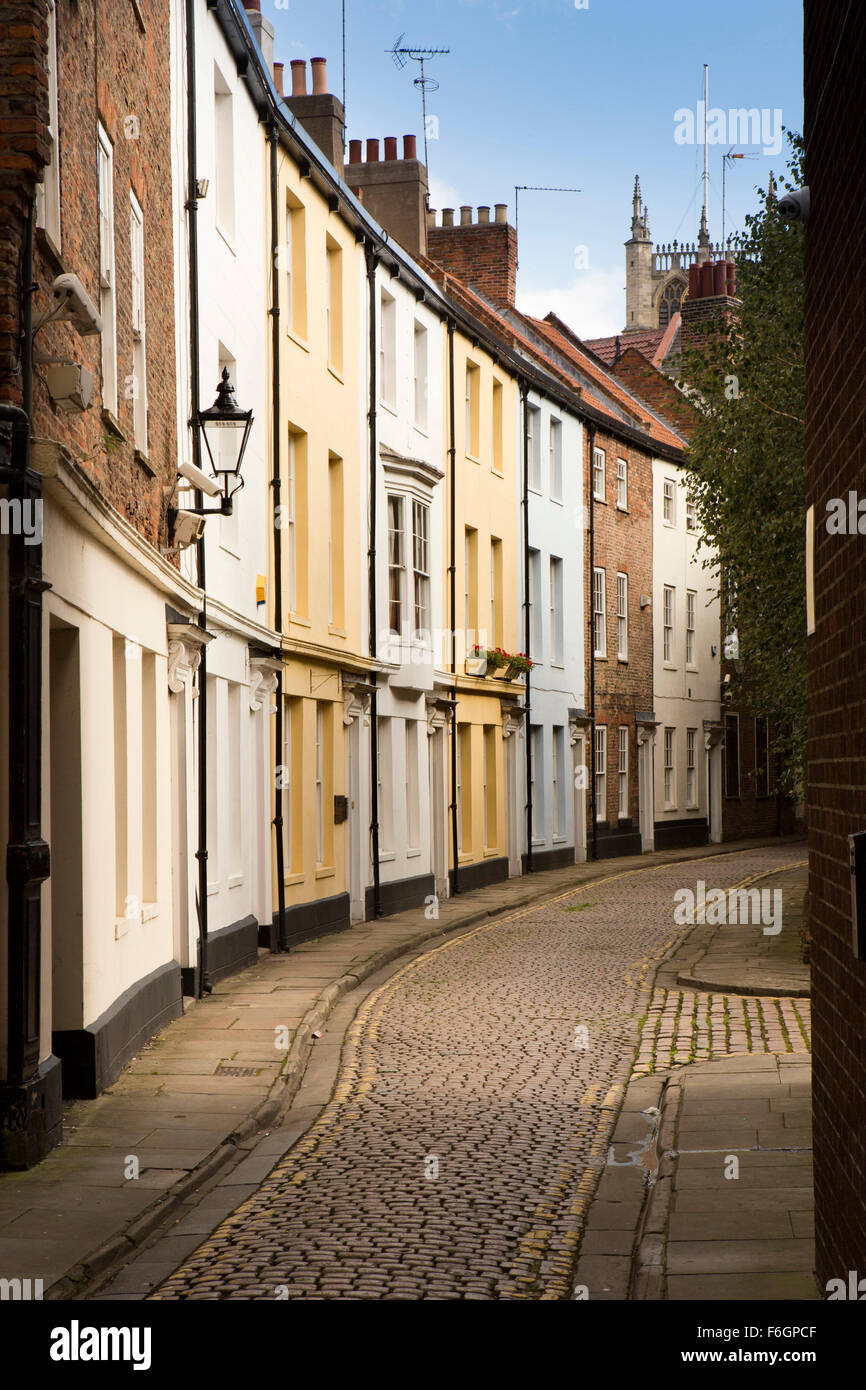 UK, England, Yorkshire, Hull, Prince Street, pastel painted terrace of old town centre homes in narrow cobbled lane Stock Photo