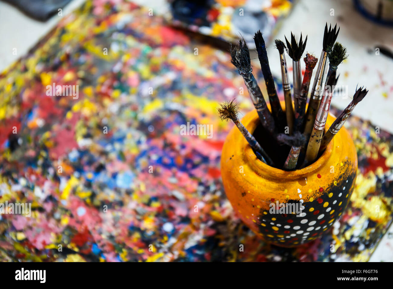 Paints and brushes on table Stock Photo Alamy