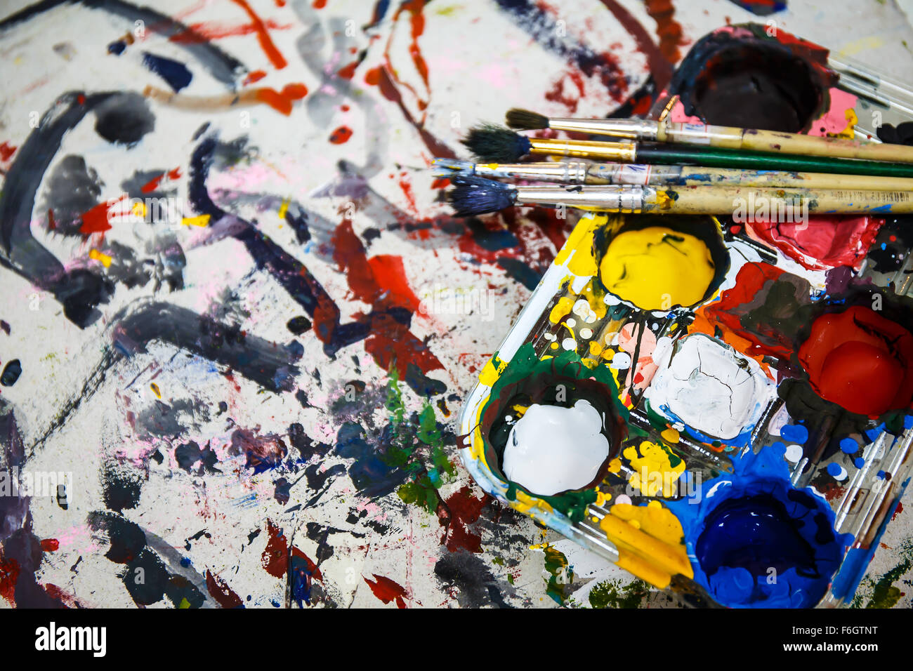 Paints and brushes on table Stock Photo Alamy