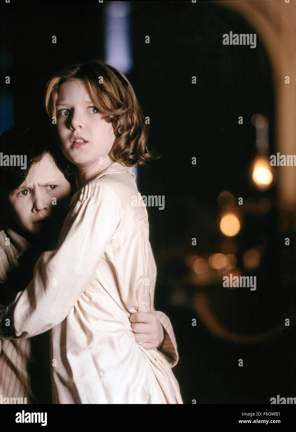 Aug 10, 2001; Los Angeles, CA, USA; Actres Nicole Kidman stars as Grace Stewart in the Miramax thriller 'The Others.' Grace lives with her children in a house that she is convinced is haunted. Pictured are JAMES BENTLEY as Nicholas and ALAKINA MANN as Anne. Stock Photo