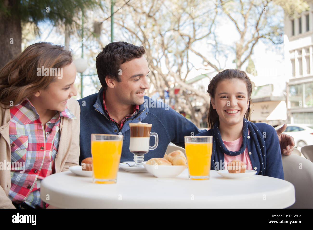Family in the coffee store Stock Photo - Alamy