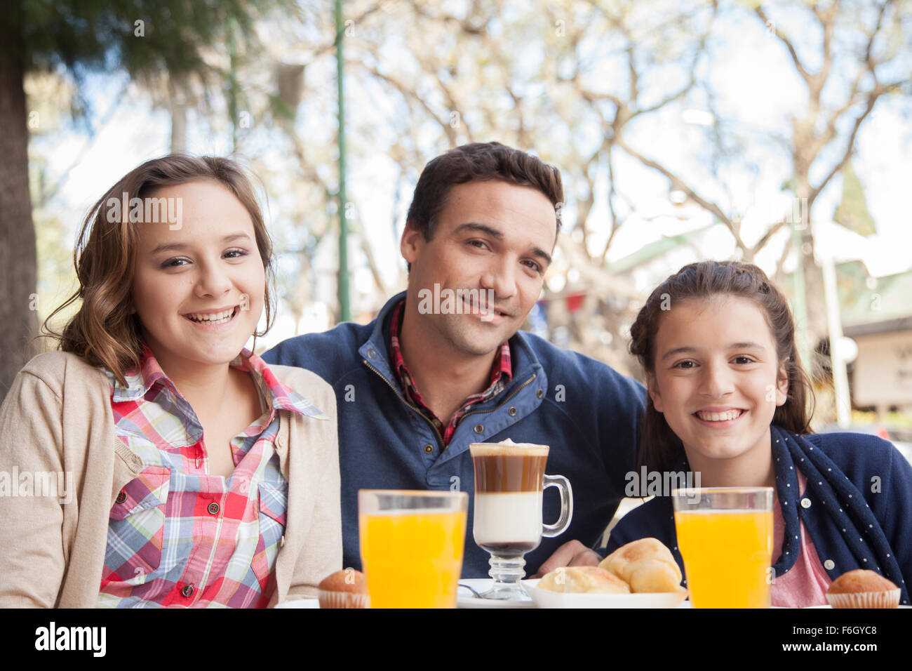 Family in the coffee store Stock Photo - Alamy