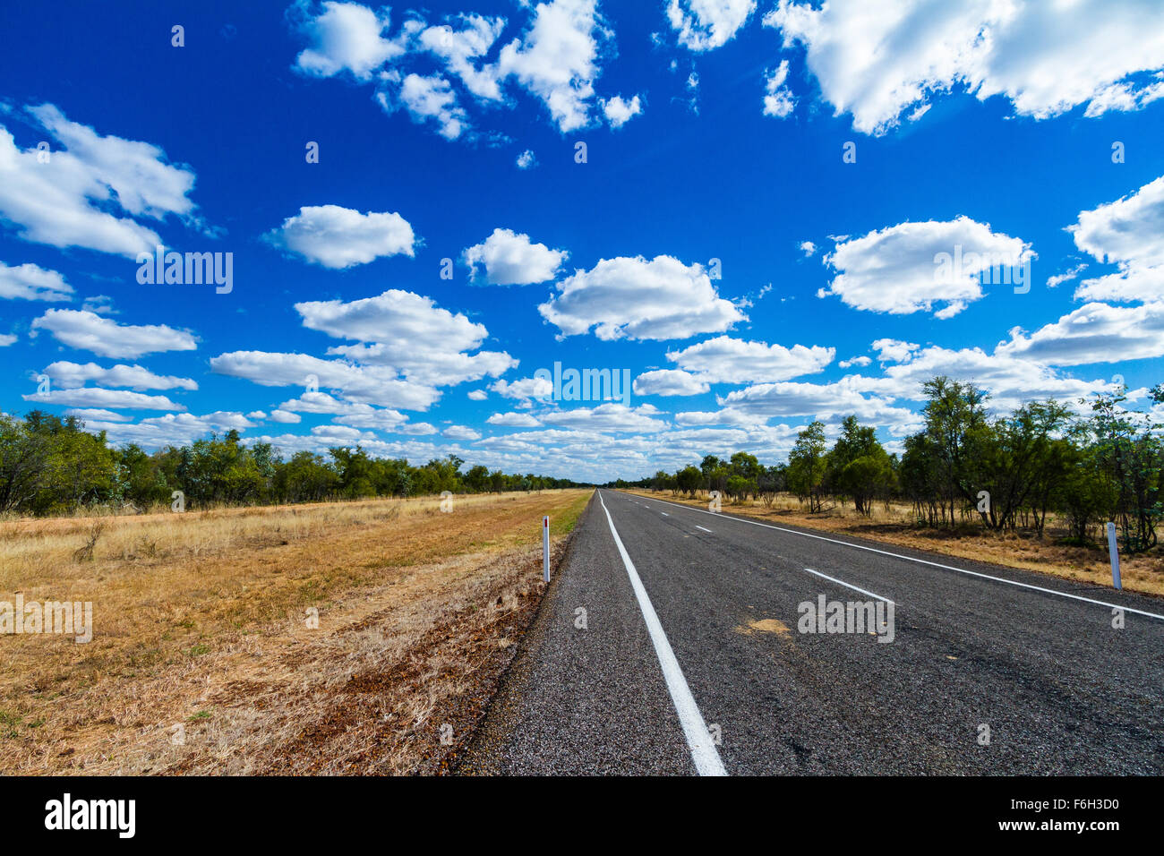 The Savannah Way has some spectacular roads and scenery. This beautiful straight section is in Northern Queensland. Stock Photo