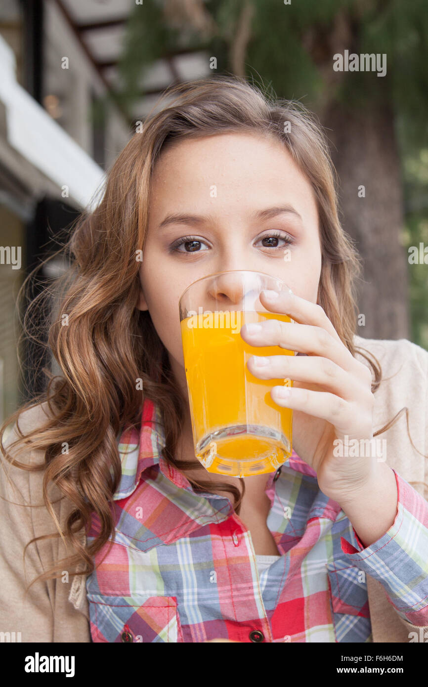 Girl drinking a juice Stock Photo