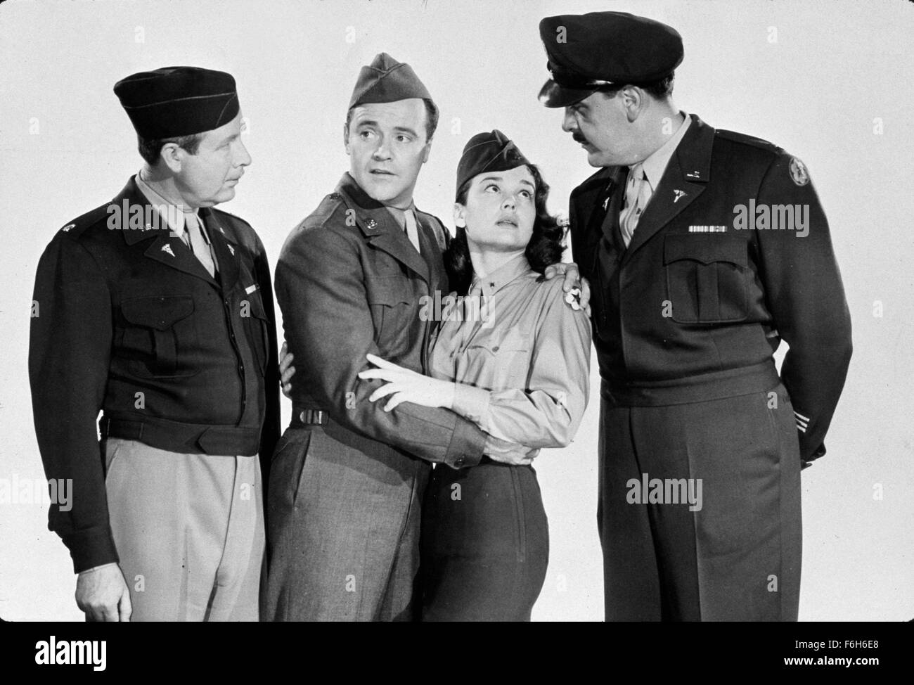 1957, Film Title: OPERATION MAD BALL, Director: RICHARD QUINE, Studio: COLUMBIA, Pictured: 1957, KATHRYN GRANT, ERNIE KOVACS, JACK LEMMON, ARTHUR O'CONNELL, LOVE - FORBIDDEN, CONTROVERSIAL, DISAPPROVAL, MILITARY, MILITARY UNIFORM, EMBRACE, CAUGHT, SHOCKED, SURPRISED, ROMANCE. (Credit Image: SNAP) Stock Photo