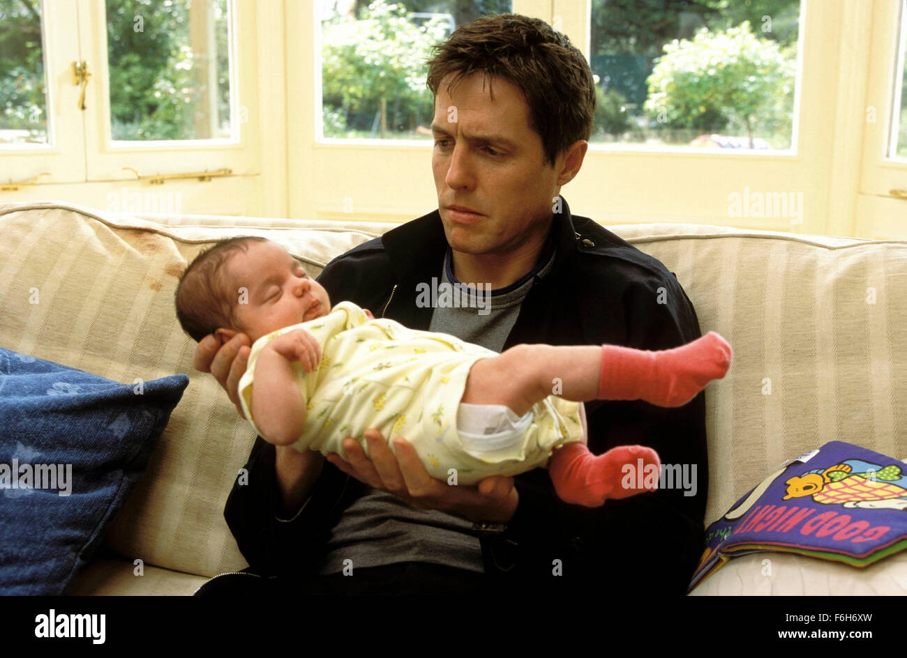 RELEASE DATE: April 26, 2002. MOVIE TITLE: About A Boy. STUDIO: Universal Pictures. PLOT: Based on Nick Hornby's best-selling novel, About A Boy is the story of a cynical, immature young man who is taught how to act like a grown-up by a little boy . PICTURED: HUGH GRANT as Will. Stock Photo