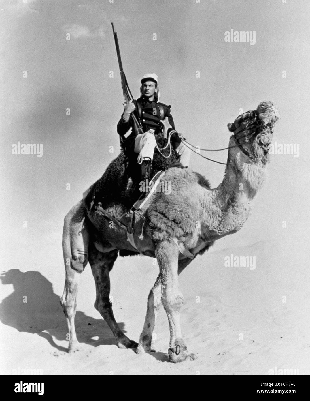 1939, Film Title: BEAU GESTE, Director: WILLIAM WELLMAN, Studio: PARAMOUNT, Pictured: CAMEL, CLOTHING, GARY COOPER, FOREIGN LEGION UNIFORM, RIFLE, WEAPONS. (Credit Image: SNAP) Stock Photo
