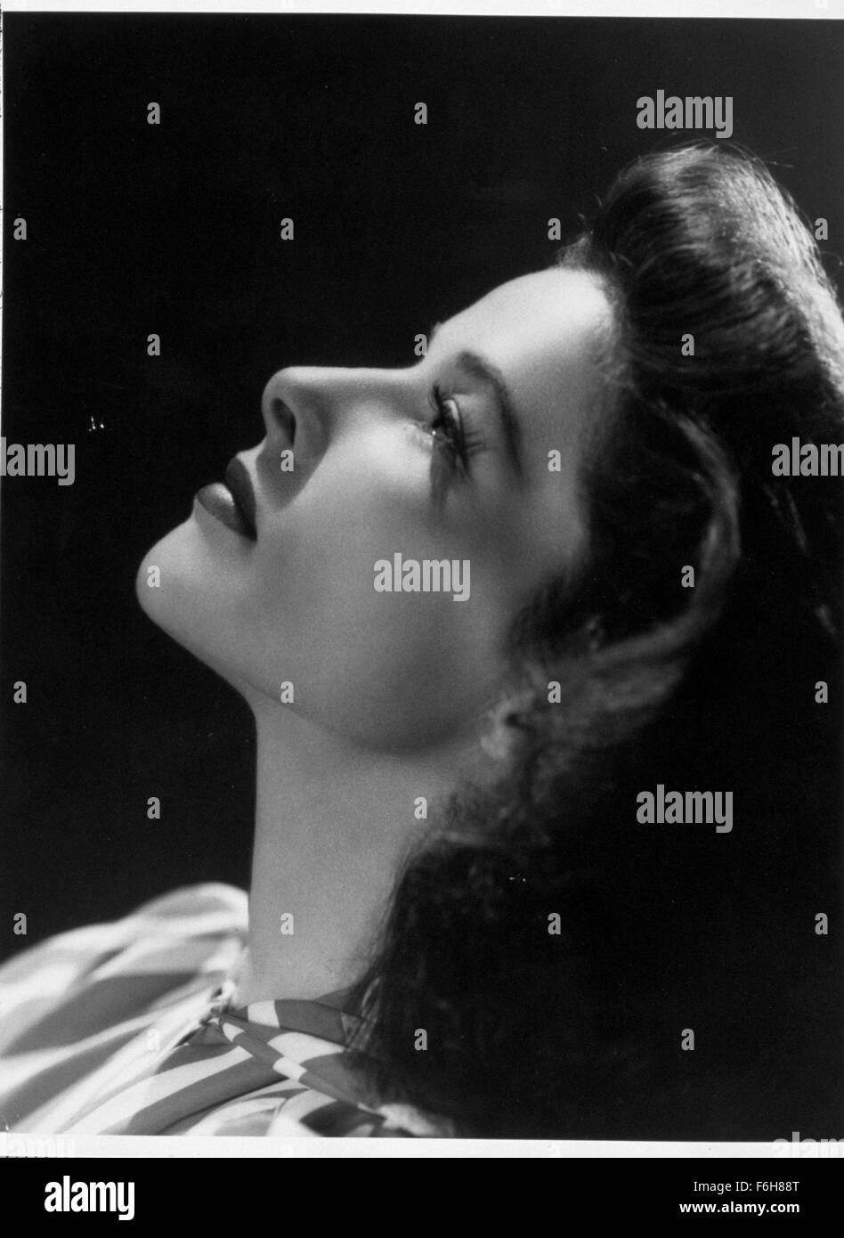 1942, Film Title: WOMAN OF THE YEAR, Director: GEORGE STEVENS, Studio: MGM, Pictured: KATHARINE HEPBURN, PROFILE, HEAD BACK, PORTRAIT, STUDIO, LOOKING UP. (Credit Image: SNAP) Stock Photo