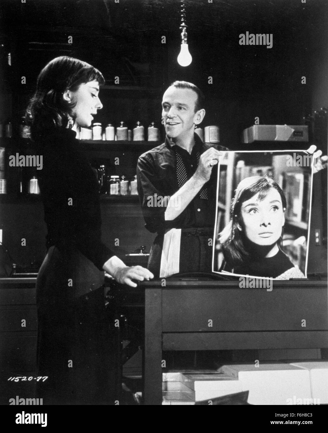 1957, Film Title: FUNNY FACE, Director: STANLEY DONEN, Studio: PARAMOUNT,  Pictured: FRED ASTAIRE, DARKROOM, AUDREY HEPBURN, PHOTOGRAPHER, LIGHT BULB,  DARK ROOM. (Credit Image: SNAP Stock Photo - Alamy, image size:1054x1390