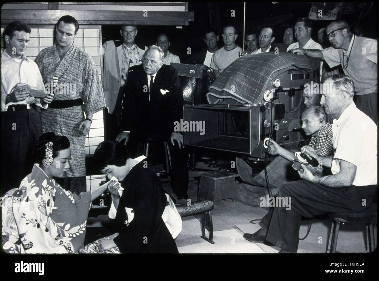1957, Film Title: SAYONARA, Director: JOSHUA LOGAN, Pictured: BEHIND THE SCENES, MARLON BRANDO, RED BUTTONS, ENSEMBLE, JOSHUA LOGAN, MOVIE CAMERA, MOVIE CREW, MOVIE SET, MIIKO TAKA. (Credit Image: SNAP) Stock Photo