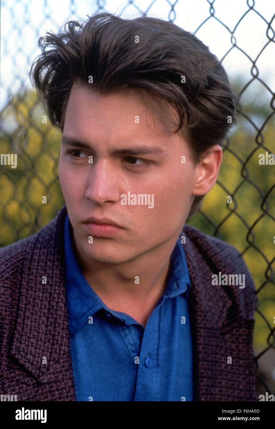1989, Film Title: 21 JUMP STREET, Pictured: JOHNNY DEPP, FENCE, CHICKEN WIRE, WIRE FENCE, HEAD SHOT, PORTRAIT, STUDIO, LOOKING AWAY. (Credit Image: SNAP) Stock Photo