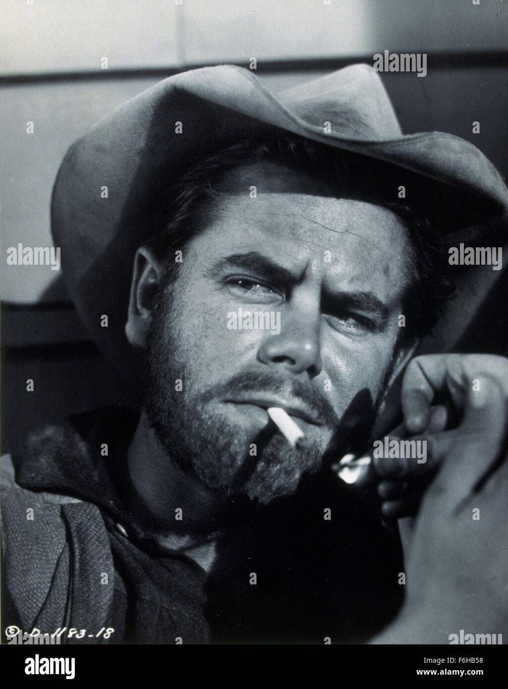 Cowboy lighting a cigarette hi-res stock photography and images