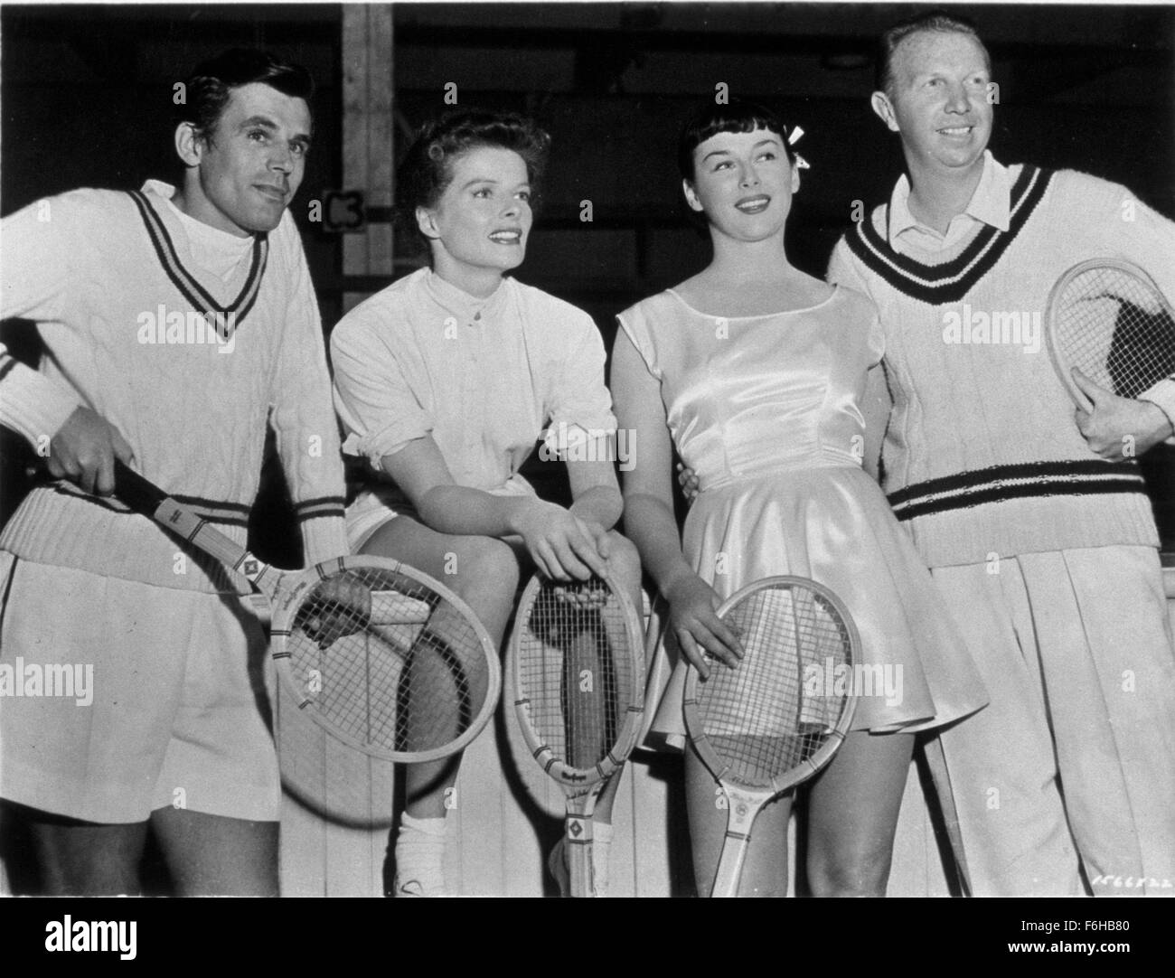 1952, Film Title: PAT AND MIKE, Director: GEORGE CUKOR, Studio: MGM, Pictured: DON BUDGE, CLOTHING, GEORGE CUKOR, KATHARINE HEPBURN, GUSSIE MORAN, MOVIE SET, FRANK PARKER, SPORT, TENNIS, RECREATION, SPORT SKIRT, SITTING, V NECK. (Credit Image: SNAP) Stock Photo