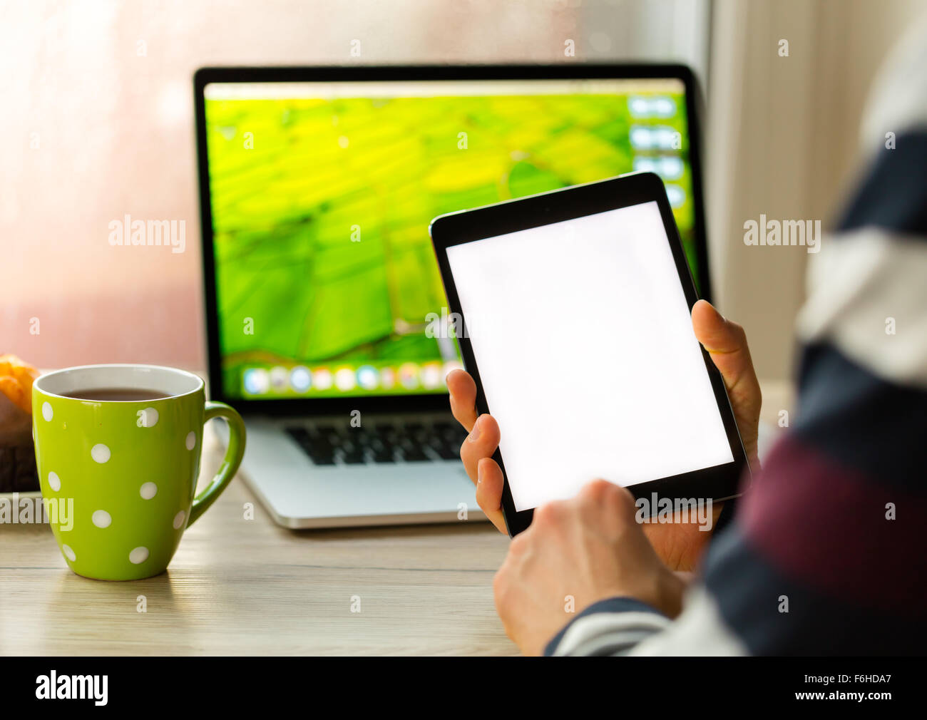 Detail of man holding digital tablet with blank screen Stock Photo - Alamy