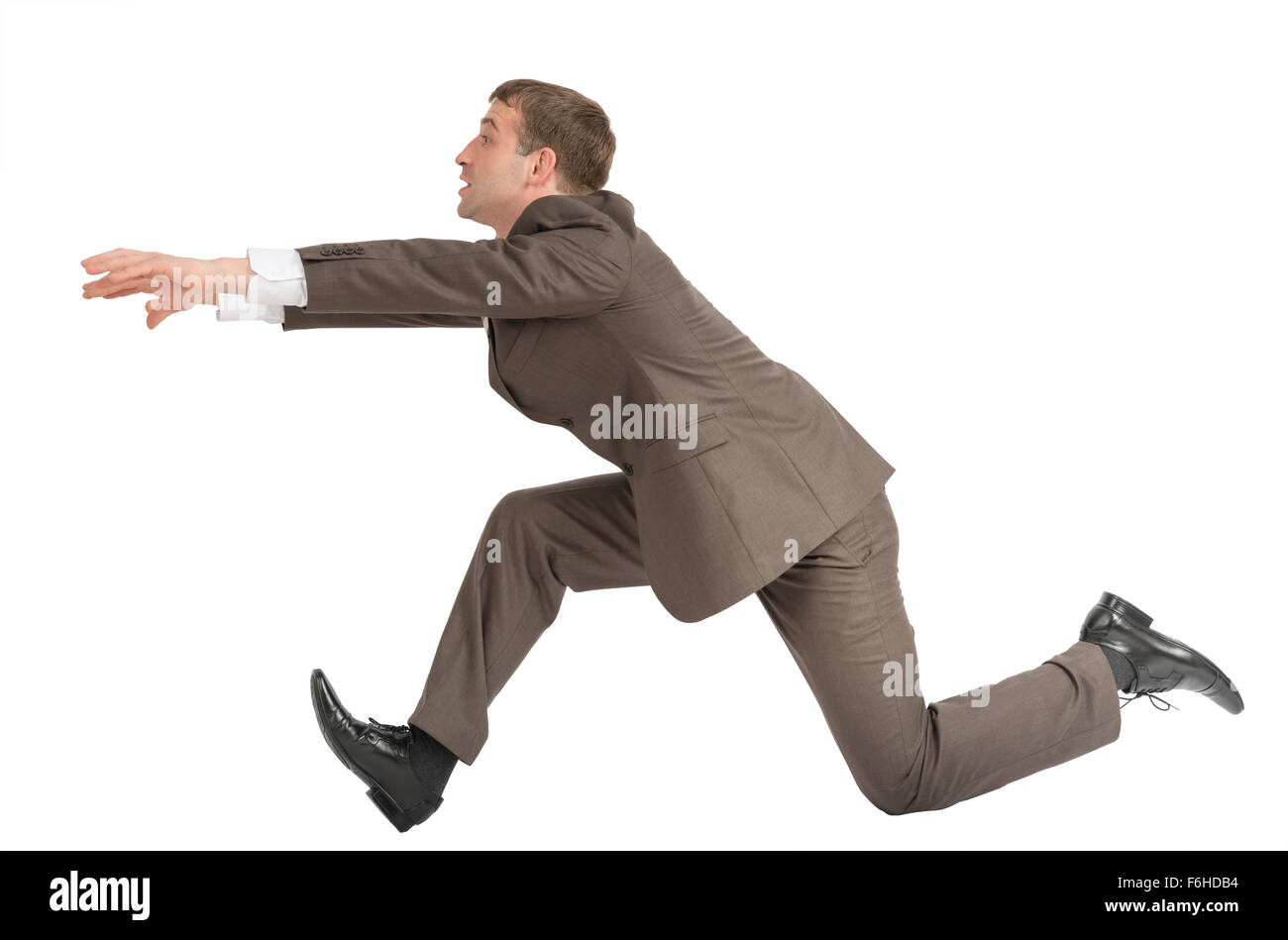 Businessman running fast Stock Photo - Alamy
