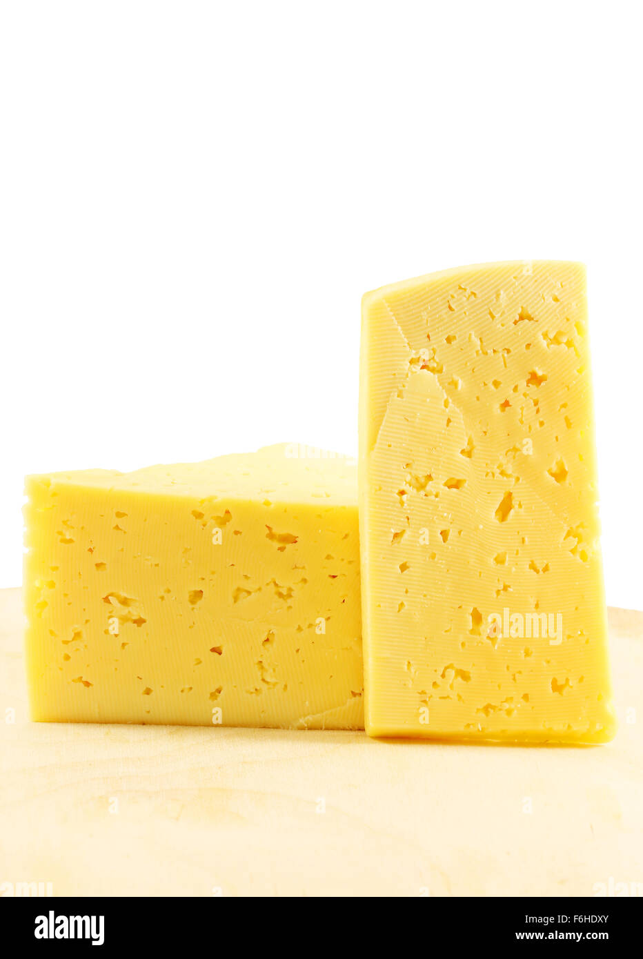 Yellow cheese photographed close up on a white background Stock Photo
