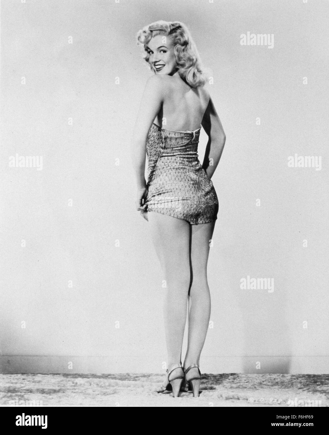 1948, Film Title: LADIES OF THE CHORUS, Director: PHIL KARLSON, Studio: COLUMBIA, Pictured: 1948, BATHING SUIT, CLOTHING, MARILYN MONROE, PIN-UPS, HANDS ON HIPS, PORTRAIT, STUDIO, LOOKING OVER SHOULDER. (Credit Image: SNAP) Stock Photo