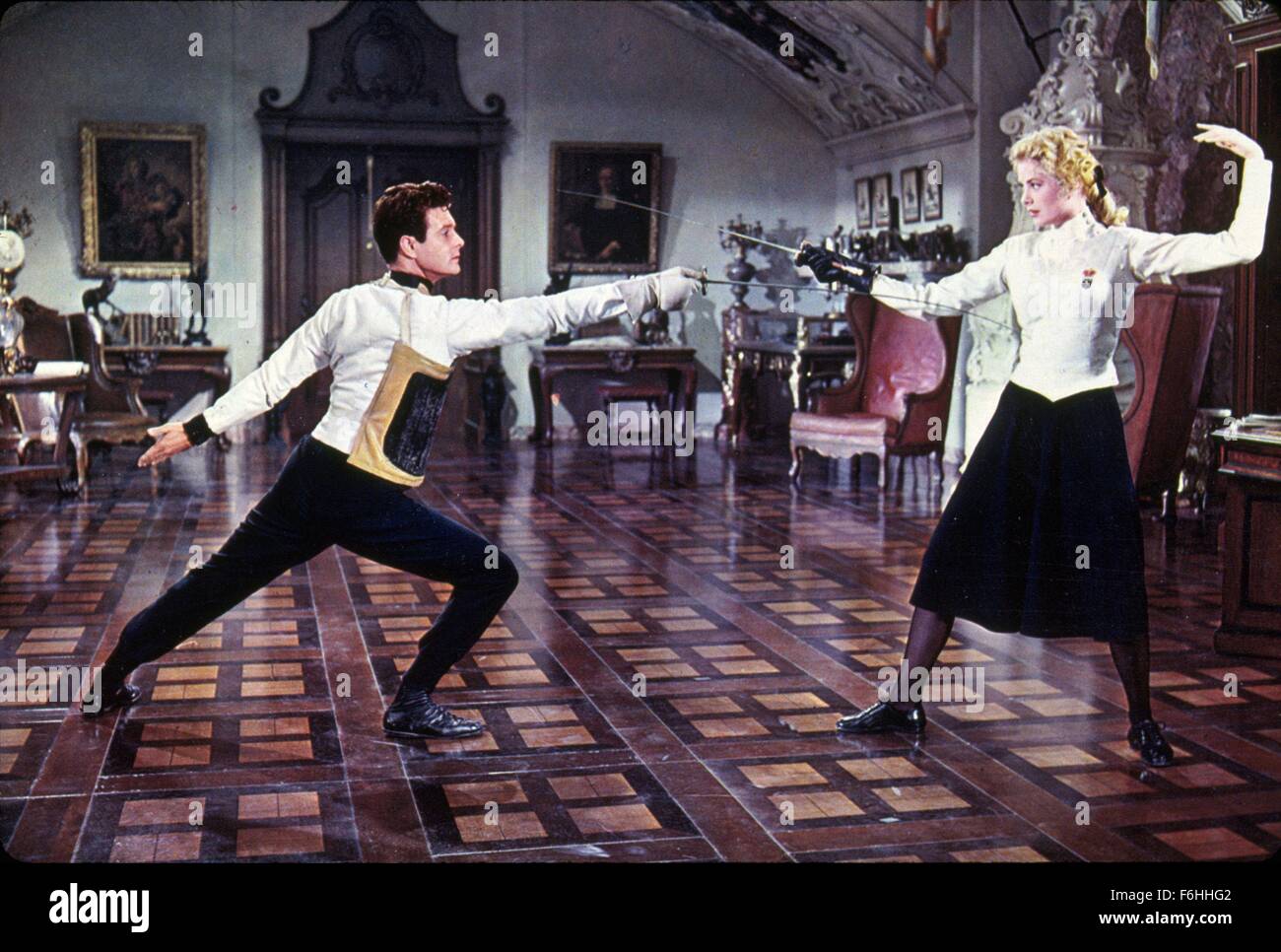 1956, Film Title: SWAN, Director: CHARLES VIDOR, Studio: MGM, Pictured: FENCING, LOUIS JOURDAN, GRACE KELLY. (Credit Image: SNAP) Stock Photo