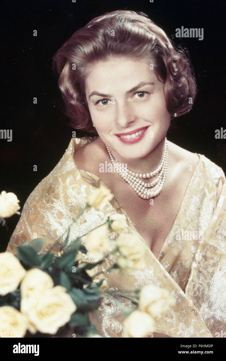 1958, Film Title: INDISCREET, Director: STANLEY DONEN, Pictured:  ACCESSORIES, INGRID BERGMAN, BLOOMS (FLOWERS), CLOTHING, STANLEY DONEN,  EVENING GOWN. (Credit Image: SNAP Stock Photo - Alamy