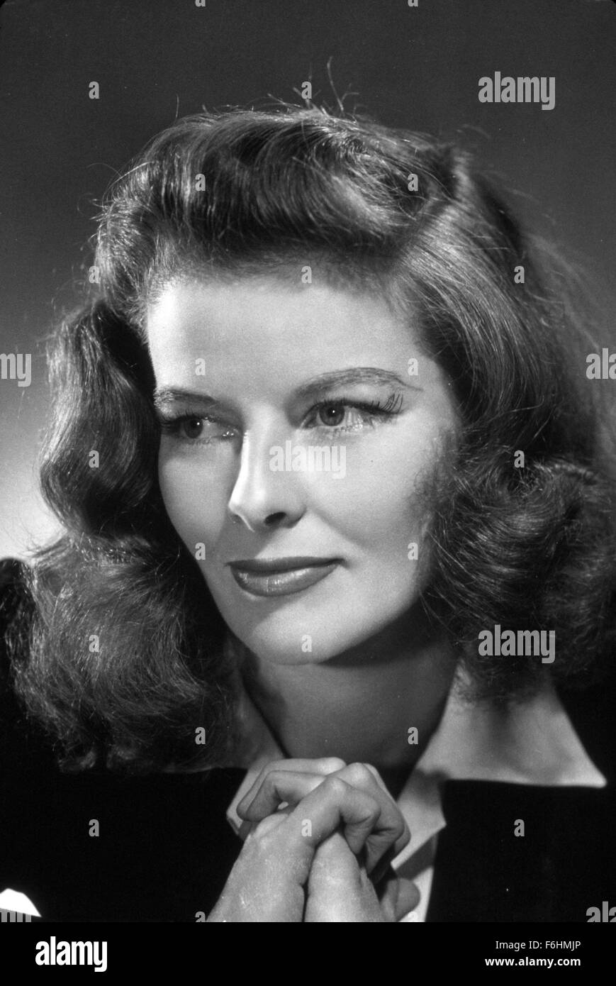 1942, Film Title: WOMAN OF THE YEAR, Director: GEORGE STEVENS, Studio: MGM, Pictured: KATHARINE HEPBURN, PORTRAIT, LOOKING AWAY, THOUGHTFUL, HANDS CLASPED, IN LOVE. (Credit Image: SNAP) Stock Photo