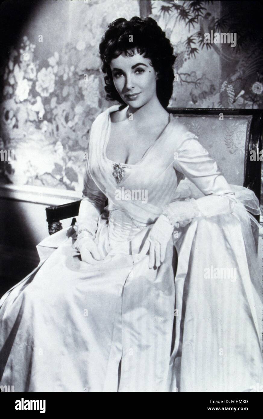 1954, Film Title: BEAU BRUMMELL, Director: CURTIS BERNHARDT, Studio: MGM, Pictured: ELIZABETH TAYLOR, LIZ TAYLOR, STUDIO, PORTRAIT, PERIOD COSTUME, DRESS - WHITE, GLOVES, CLEAVAGE, SITTING, SEATED. (Credit Image: SNAP) Stock Photo