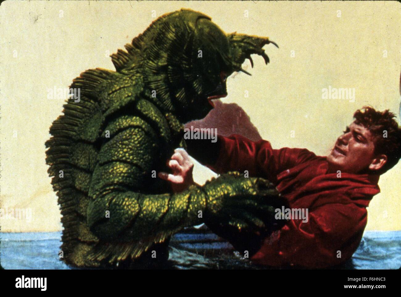 1955, Film Title: REVENGE OF THE CREATURE, Director: JACK ARNOLD, Studio: UNIV, Pictured: JOHN BROMFIELD, ITS & ALIENS! THINGS, SCARED, GRIP, GRASP, SHAKING, SCALES, MONSTER, SEA MONSTER, SCI-FI, HORROR, ATTACKING, FEAR. (Credit Image: SNAP) Stock Photo