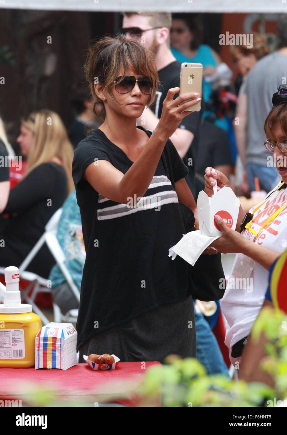 Halle Berry attends a Halloween festival with her husband and son