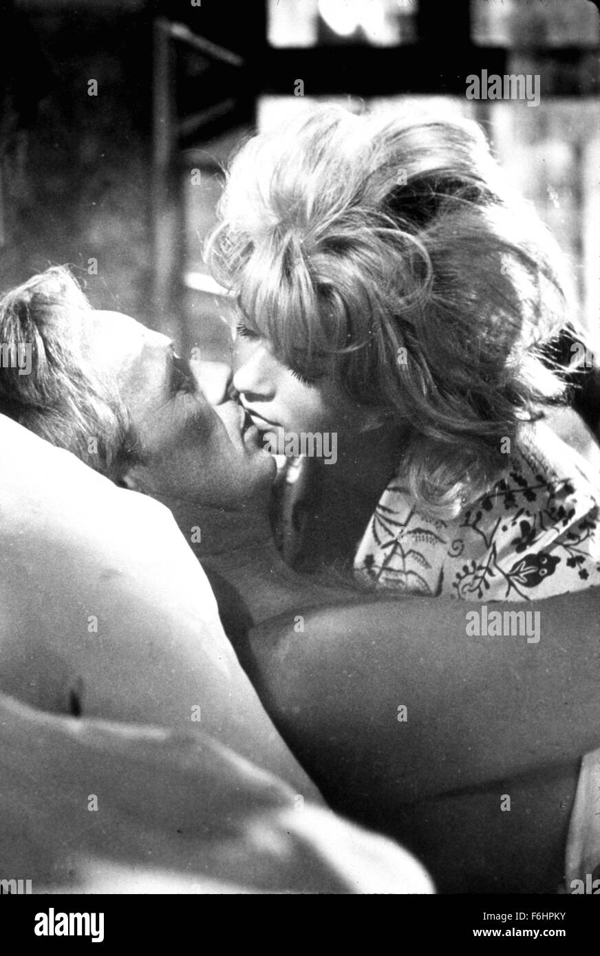 1961, Film Title: SECRET WAYS, Director: PHIL KARLSON, Studio: UNIV, Pictured: BED (IN/ON), SENTA BERGER, PHIL KARLSON, KISSING, ROMANCE. (Credit Image: SNAP) Stock Photo