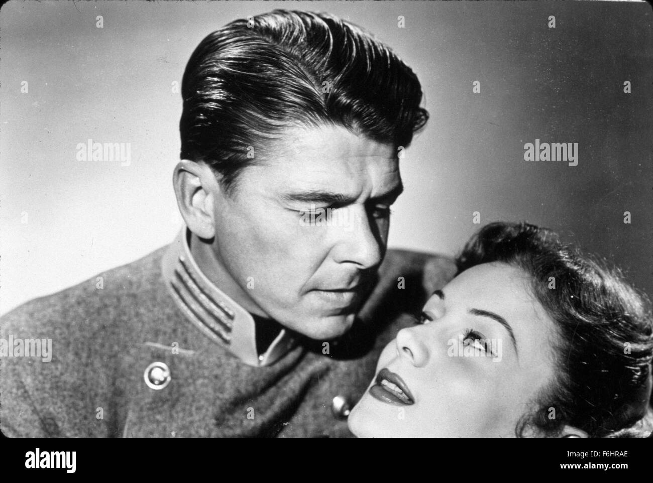 1951, Film Title: LAST OUTPOST, Director: LEWIS R FOSTER, Studio: PARAMOUNT, Pictured: RHONDA FLEMING, RONALD REAGAN, MILITARY UNIFORM, ROMANCE, LOVE (WARTIME ROMANCE), GAZE, GAZING. (Credit Image: SNAP) Stock Photo