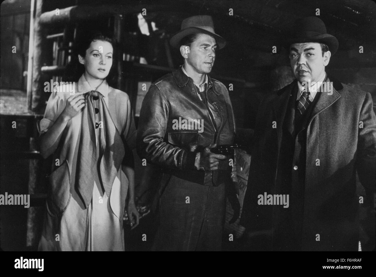 1952, Film Title: HONG KONG, Director: LEWIS R FOSTER, Studio: PARAMOUNT, Pictured: RHONDA FLEMING, MARVIN MILLER, RONALD REAGAN, THREATENING, GUN CRAZY, OVERCOATS, WAREHOUSE, HOSTAGE. (Credit Image: SNAP) Stock Photo