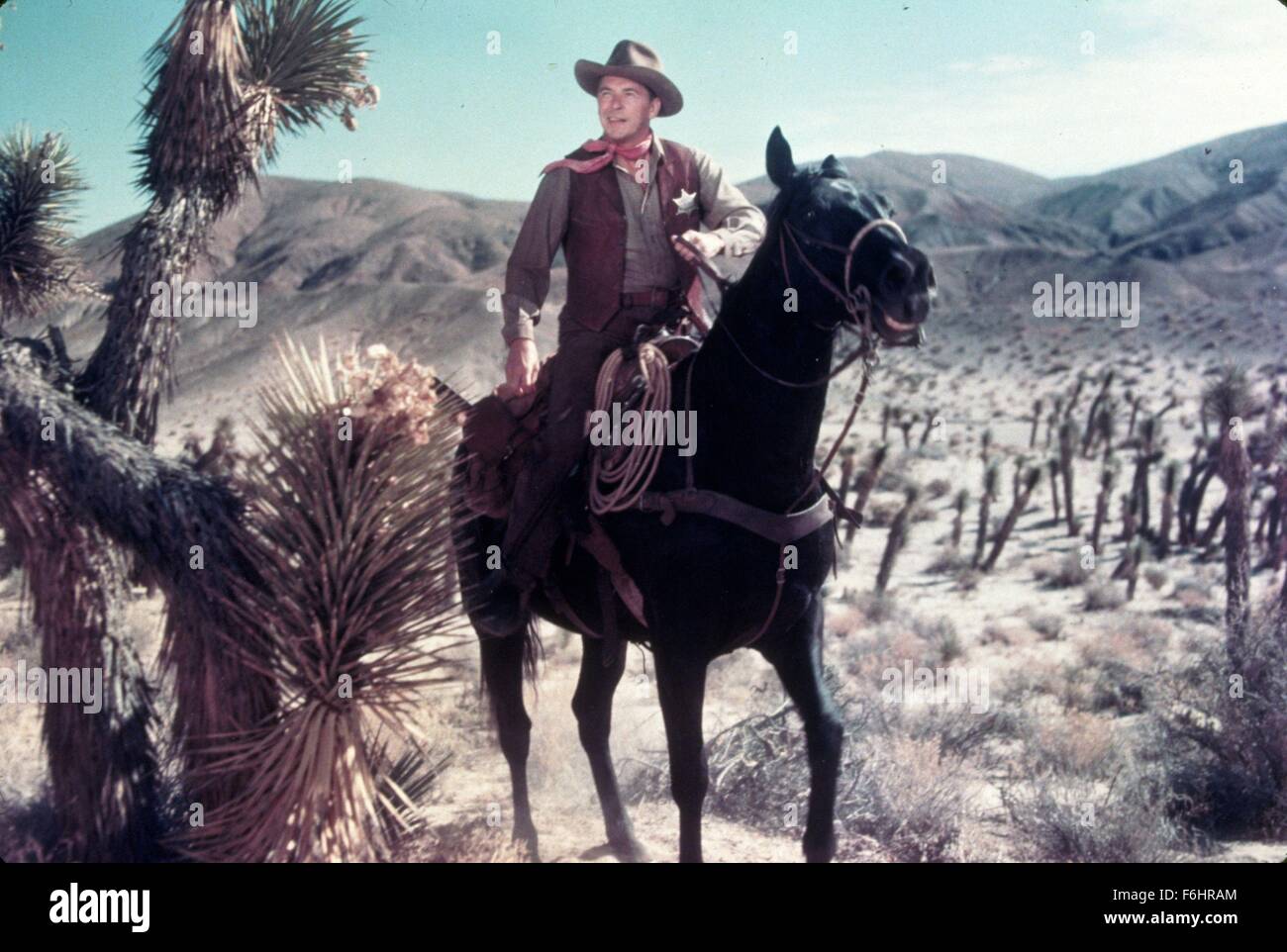 1953, Film Title: LAW AND ORDER, Director: NATHAN JURAN, Studio: UNIV, Pictured: HORSE, COWBOY HAT, RONALD REAGAN, RIDING, WESTERN, SHERIFF, COWBOY, DESERT. (Credit Image: SNAP) Stock Photo