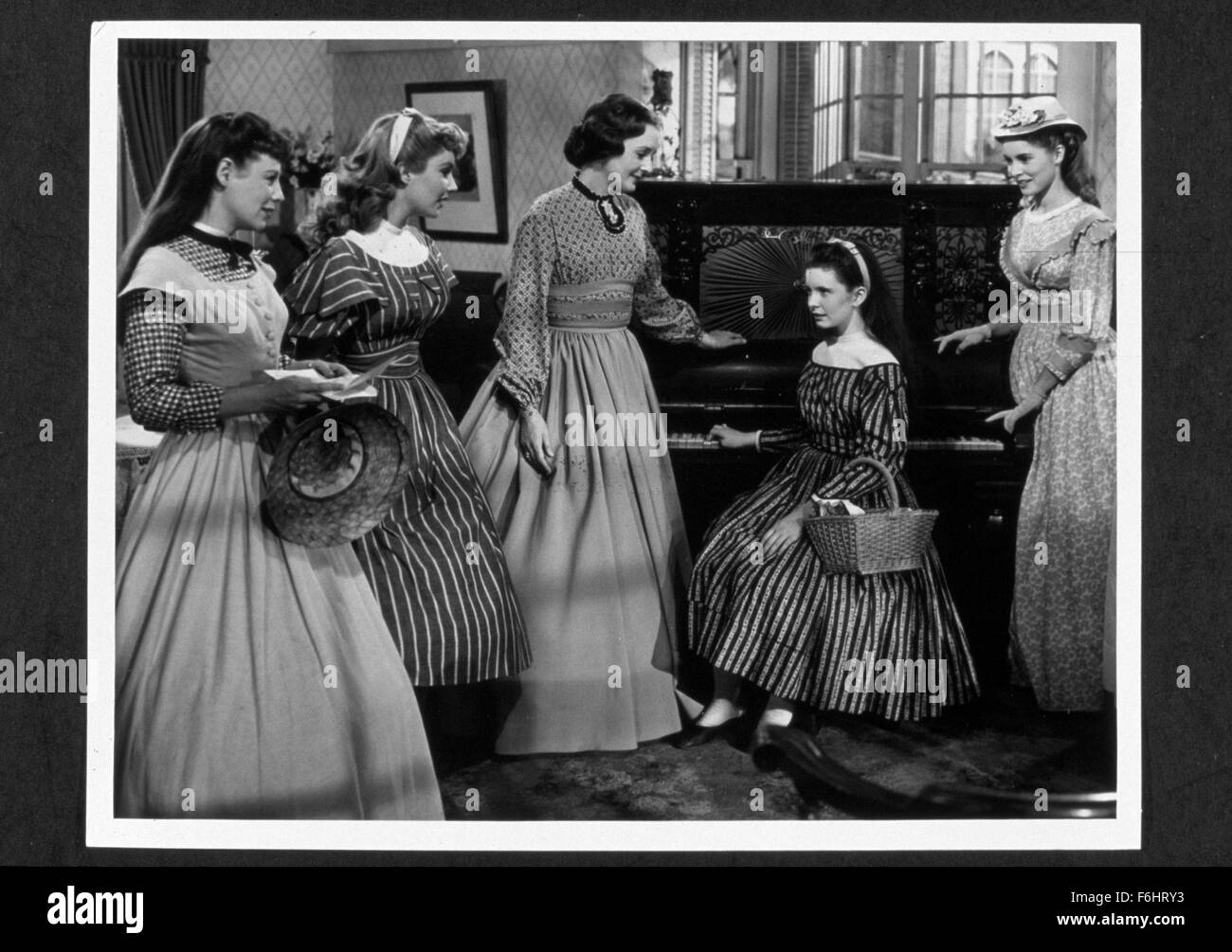 1949, Film Title: LITTLE WOMEN, Director: MERVYN LeROY, Studio: MGM, Pictured: JUNE ALLYSON, MARY ASTOR, JANET LEIGH, MERVYN LeROY, MARGARET O'BRIEN, ELIZABETH TAYLOR, PERIOD COSTUME, ACCOMPLISHED, PIANO. (Credit Image: SNAP) Stock Photo
