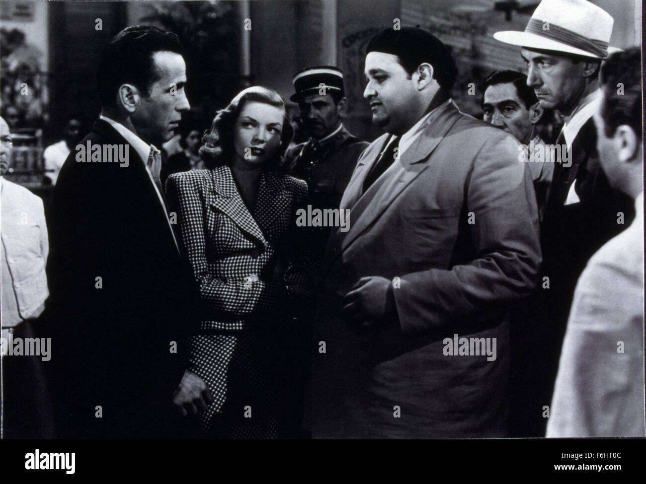 1944, Film Title: TO HAVE AND HAVE NOT, Director: HOWARD HAWKS, Studio: WARNER, Pictured: LAUREN BACALL, HUMPHREY BOGART, DAN SEYMOUR, CONFLICT, CONFRONTATION, ON LOOKERS, CROWD, ENSEMBLE, WORRIED, TOUGH GUYS. (Credit Image: SNAP) Stock Photo