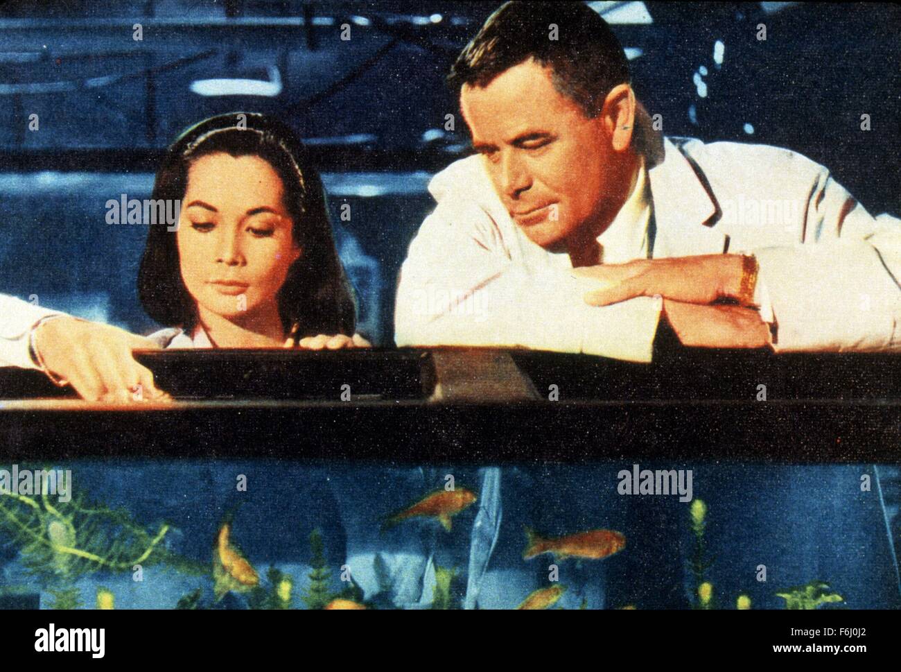 1964, Film Title: FATE IS THE HUNTER, Director: RALPH NELSON, Studio: FOX, Pictured: GLENN FORD, NANCY KWAN. (Credit Image: SNAP) Stock Photo