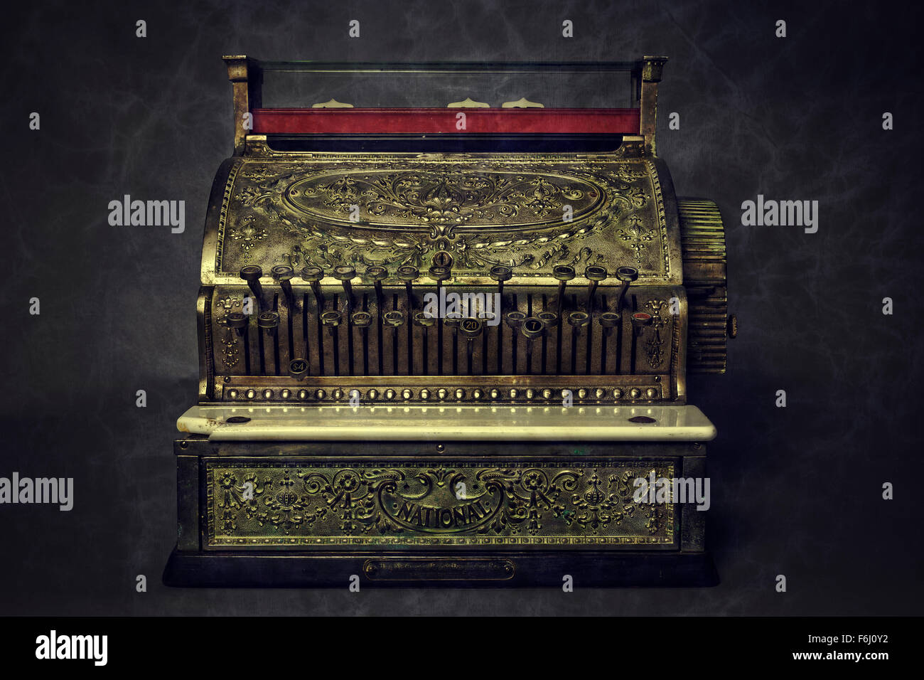 A cash register of gold provides good luck to any establishment. Stock Photo