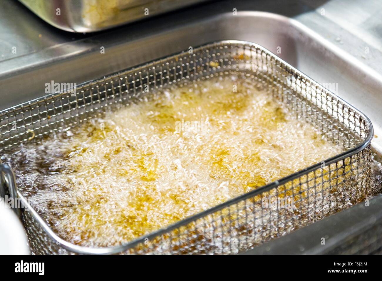 deep fryer with fried potato Stock Photo Alamy