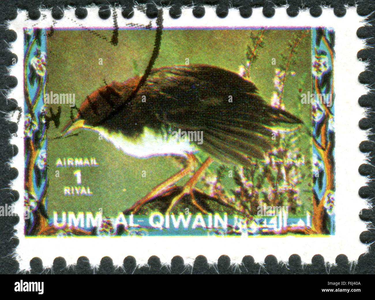 Postage stamp printed in Umm al-Quwain, show bird Red-and-white Crake (Laterallus leucopyrrhus) Stock Photo