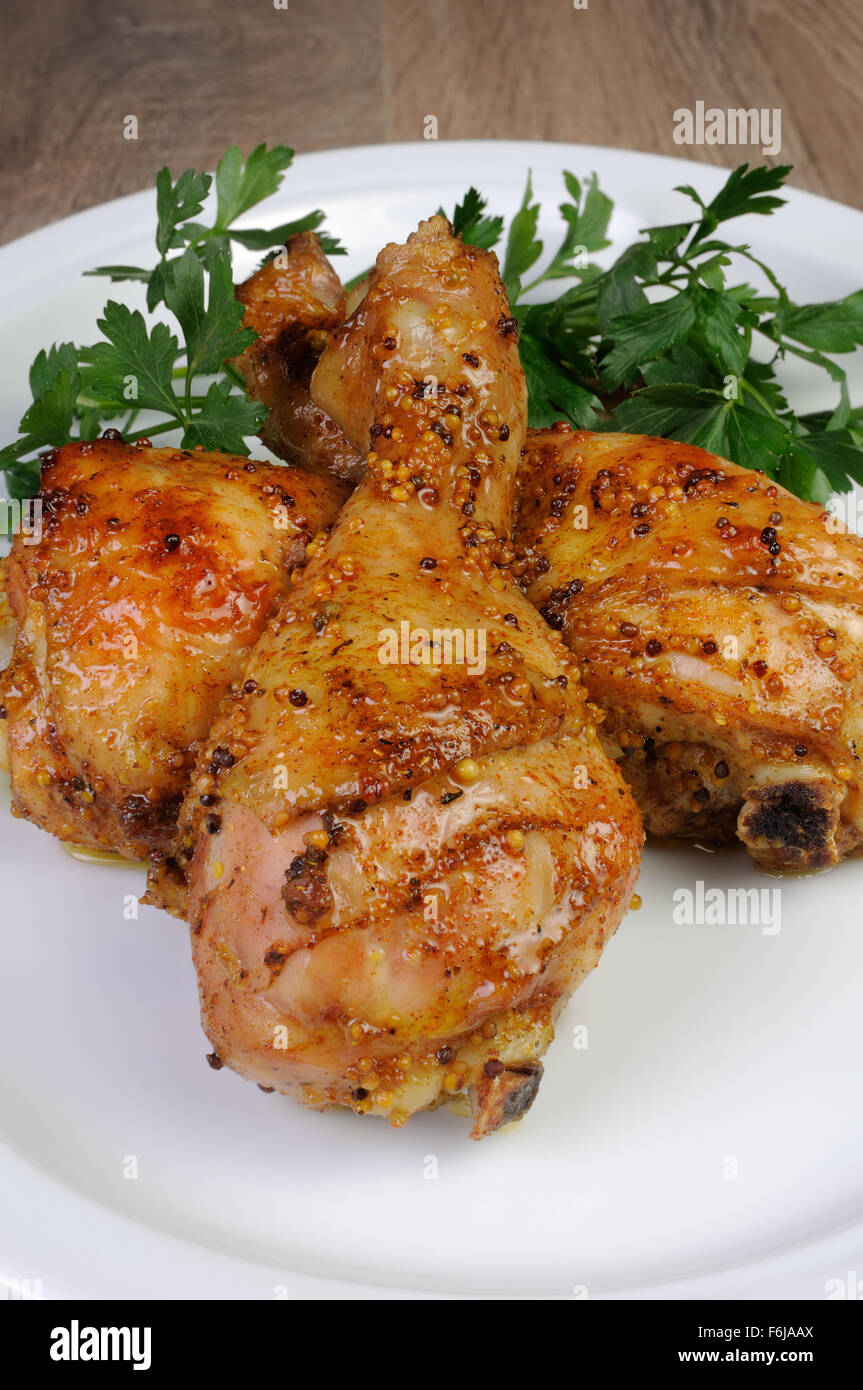 Baked chicken drumstick in Dijon mustard Stock Photo Alamy