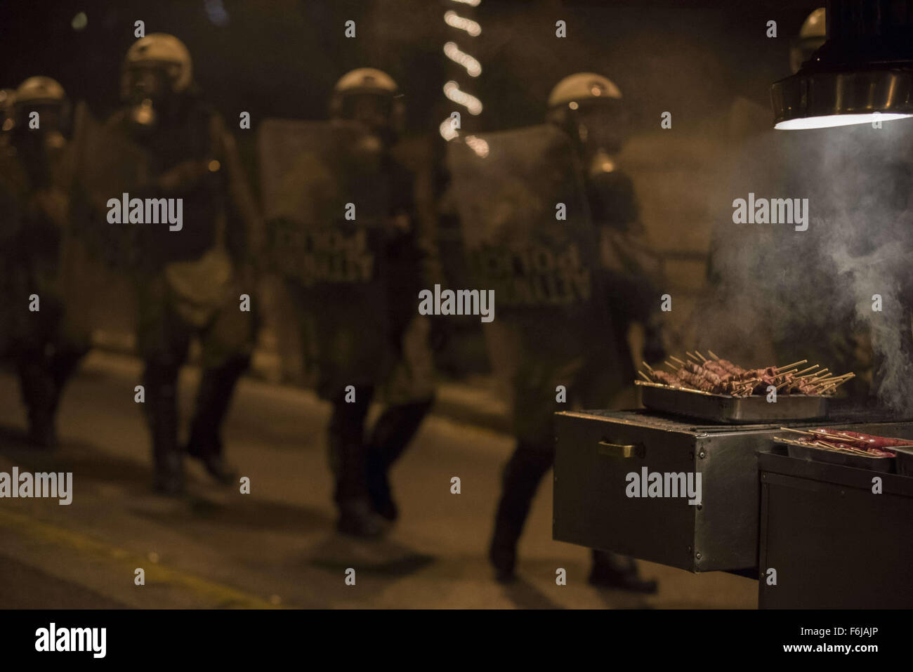Athens, Greece. 17th Nov, 2015. Riot police pass by a street cantine as ...