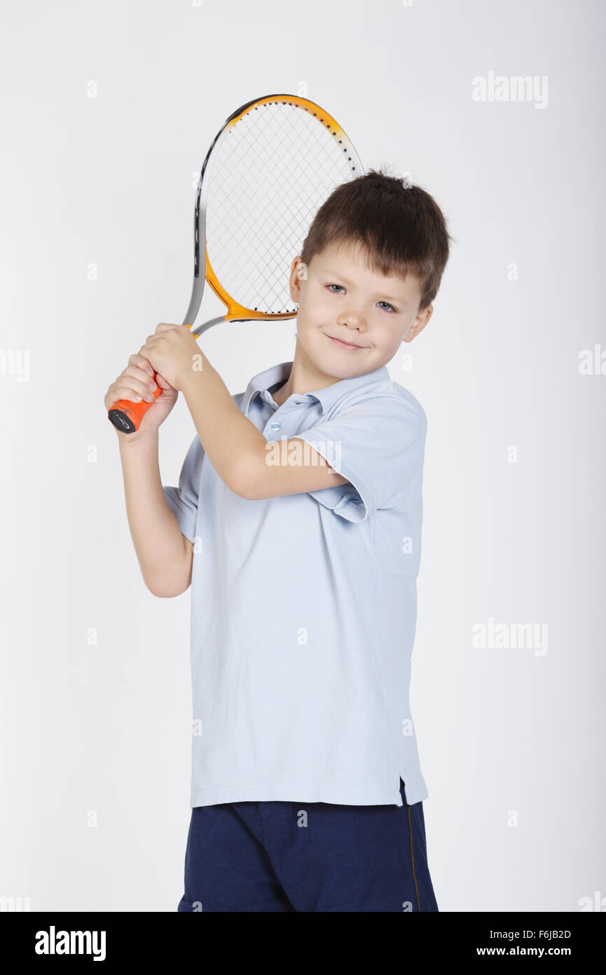 Kid Throwing A Racket little boy with racket and balls Stock Photo - Alamy