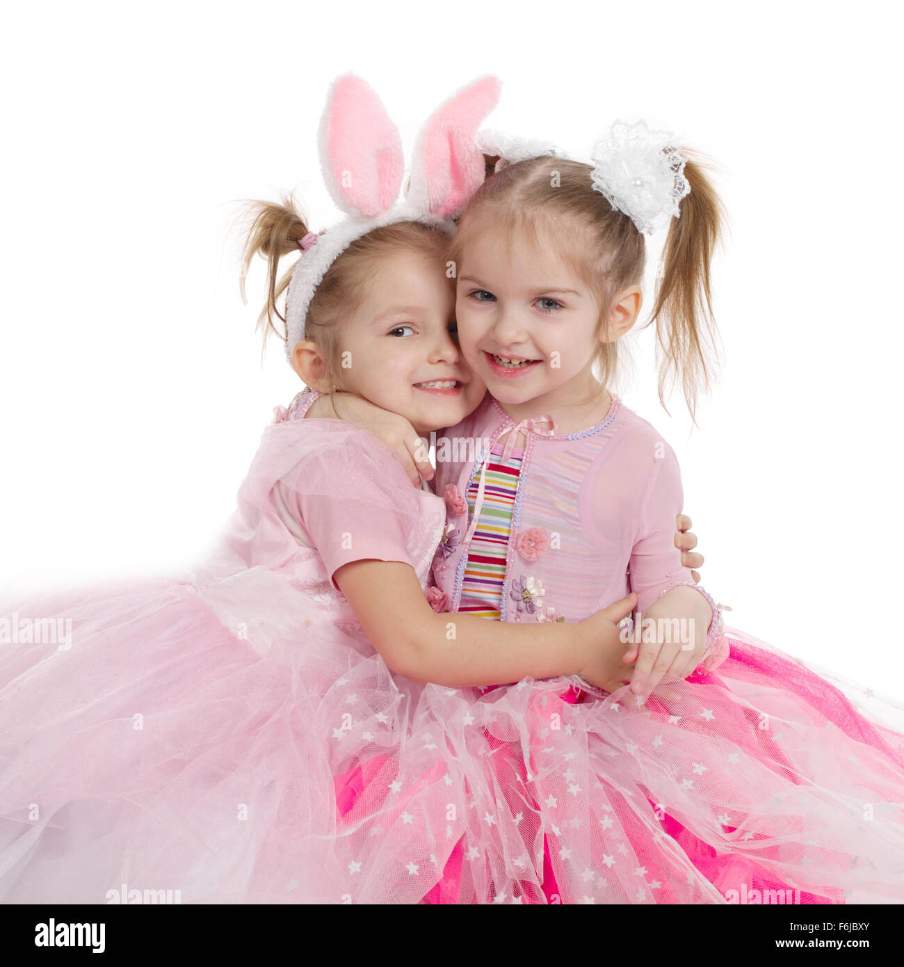 Two little girls - best friends on white Stock Photo